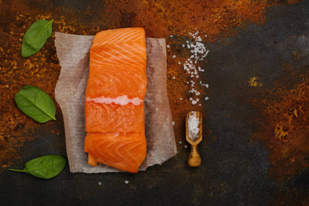 istock Raw fresh salmon steak with spinach lieaves 851003848