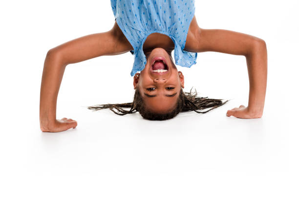 istock little girl upside down on a white background 851004528
