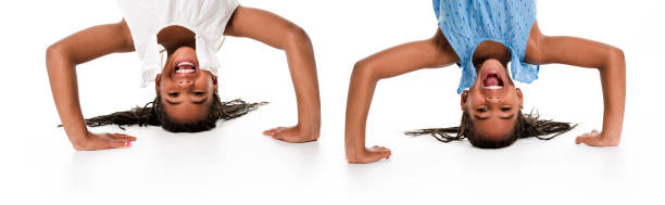 istock twin girls upside down on a white background 851004662