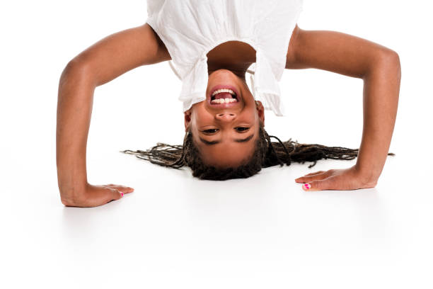 istock little girl upside down on a white background 851004858