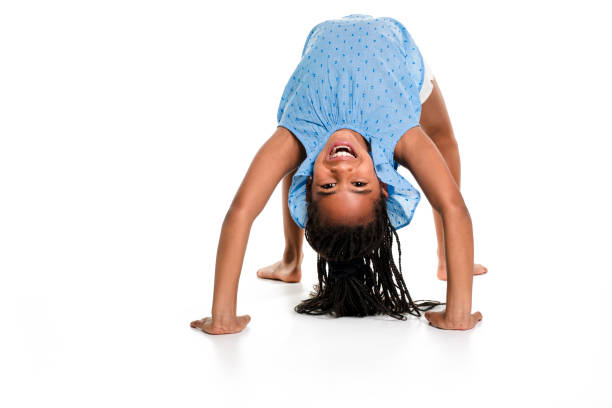 istock little girl upside down on a white background 851004962