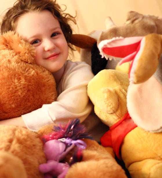 istock Cute girl hugging each other her teddy 851007928