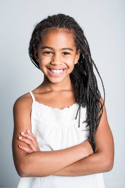 Adorable african little girl on studio gray background