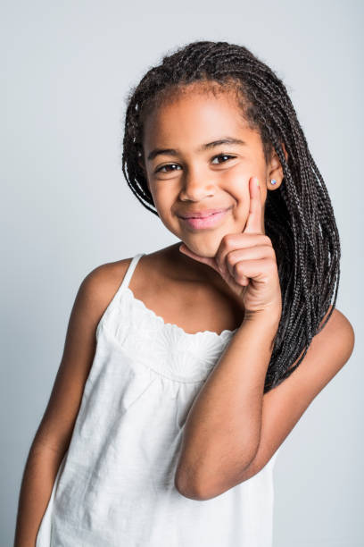 istock Adorable african little girl on studio gray background 851008584