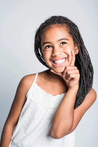 istock Adorable african little girl on studio gray background 851008768