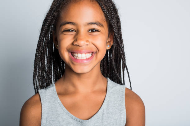 istock Adorable african little girl on studio gray background 851014718