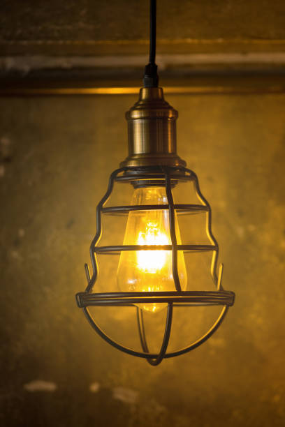 istock Decorative antique edison style light bulbs against brick wall background 851021538