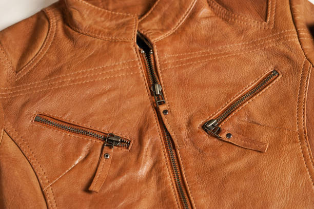 istock Light brown leather jacket. Beige color leather jacket on hanger 851025378