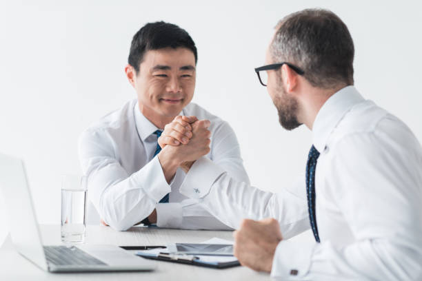 istock multicultural businessmen shaking hands on meeting 851030398