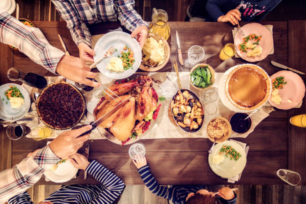 istock Family Having Traditional Holiday Stuffed Turkey Dinner 851034550
