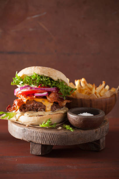istock bacon cheese burger with beef patty, tomato, onion 851041674