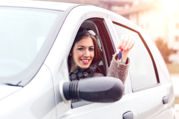 istock Young woman showing the car key 851046232