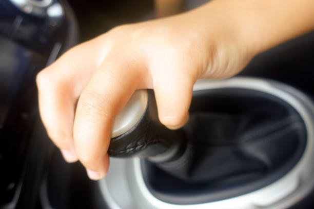 istock Hand driver shifting gear stick before driving car. 851046294