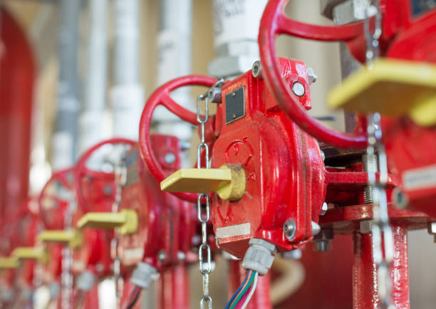 The valve of system Industrial of  fire extinguishing. The valve of system Industrial of  fire extinguishing. Selective focus. water pump photos stock pictures, royalty-free photos & images
