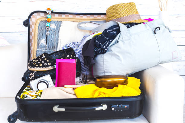 istock Packed suitcase of vacation items 851048974