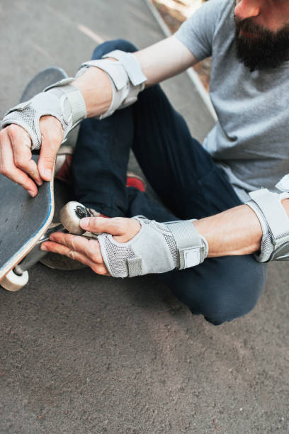 istock Professional skater checks his skateboard 851056592