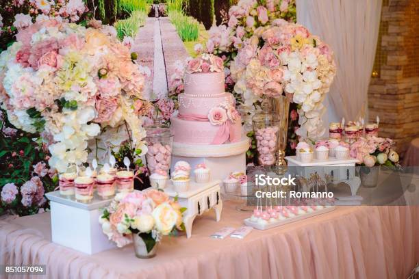 Candy Bar And Wedding Cake Table With Sweets Buffet With Cupcakes Candies Dessert Stock Photo - Download Image Now