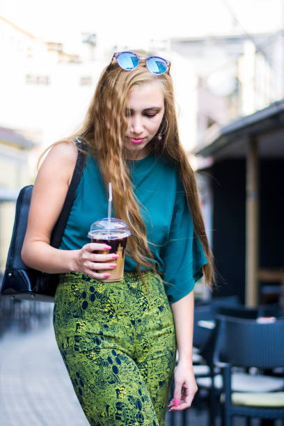 istock Urban girl with coffee on the street 851094792