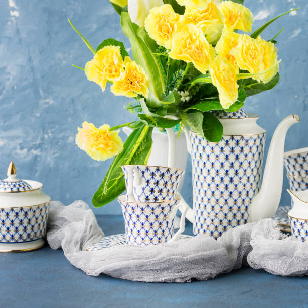 istock Easter tea party festive set and yellow flowers 851102322