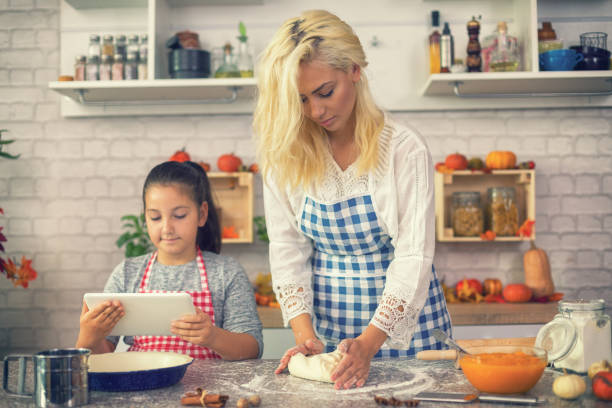 istock Family Preparing Pumpkin Pie 851102748