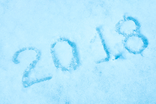2018 written on a real snow. Colored in blue.