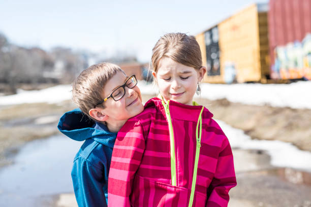 istock Brother and sister close to a train 851107604
