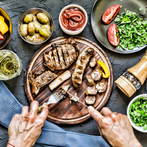 istock Man eats a juicy barbecue steak. 851111618