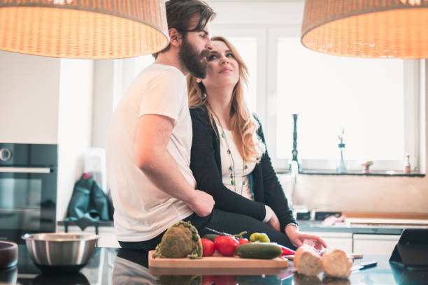 istock Happy couple preparing food in the kitchen 851113948