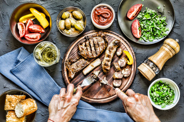 istock Man eats a juicy barbecue steak. 851116030