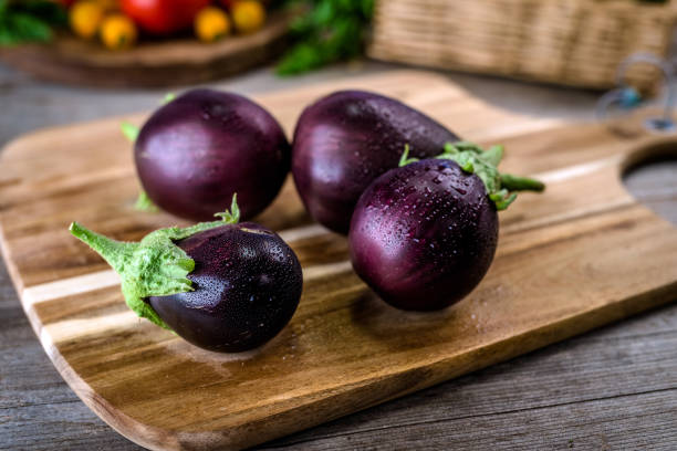 istock Eggplant on vintage wooden background 851148236