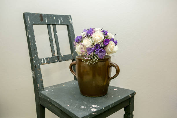 Part of Old chair and flower in vase