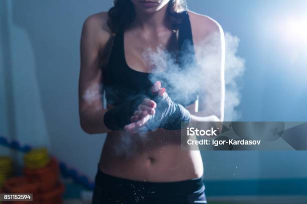 Young Fighter Boxer Girl In Training With Heavy Punching Bag Stock Photo - Download Image Now