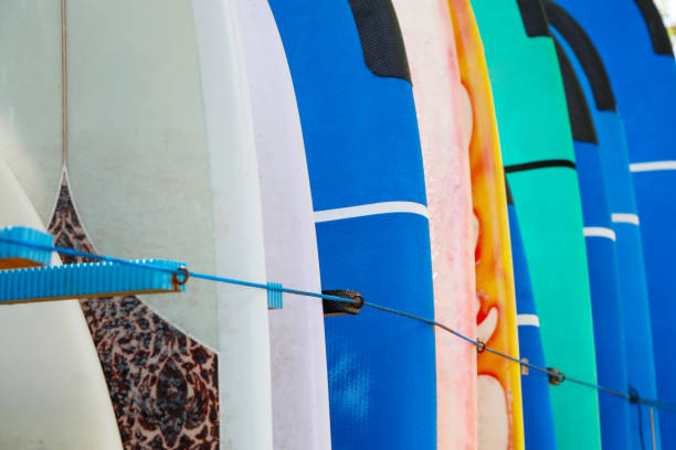 istock Stack of colorful surfboards ready for rent on the beach 851155100