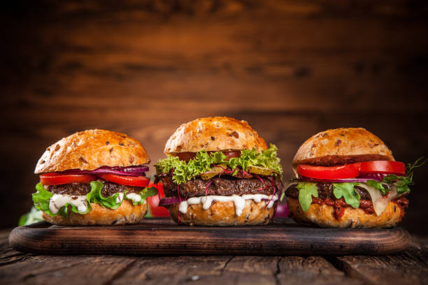 close-up of home made burgers - barbecue grill barbecue burger hamburger imagens e fotografias de stock