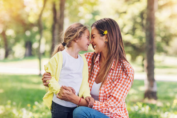 Mother and daugher rubbing noses
