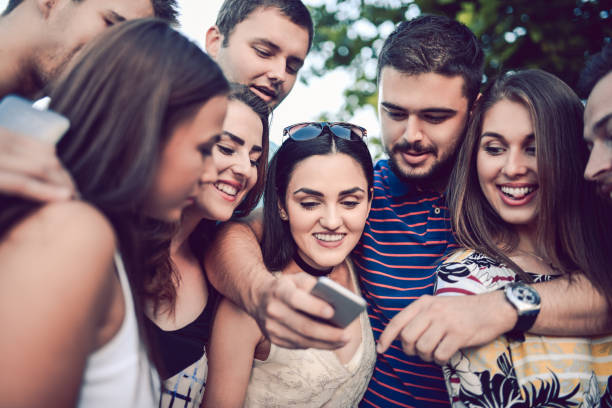 istock Group of Young People Watching Funny Video and Having Great Time 851160034