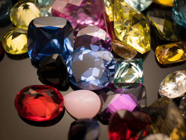 Jewel or gems on black shine color, Collection of many different natural gemstones amethyst, lapis lazuli, rose quartz, citrine, ruby, amazonite, moonstone, labradorite, chalcedony, blue topaz stock photo