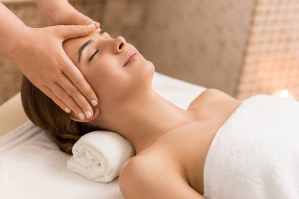 istock woman relaxing and having head massage 851169130