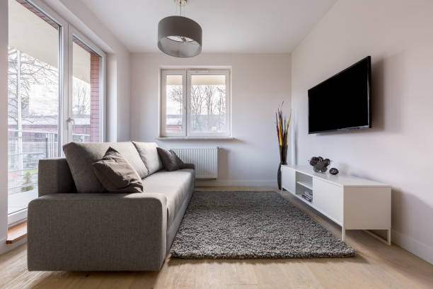 istock Living room with brown couch 851173018