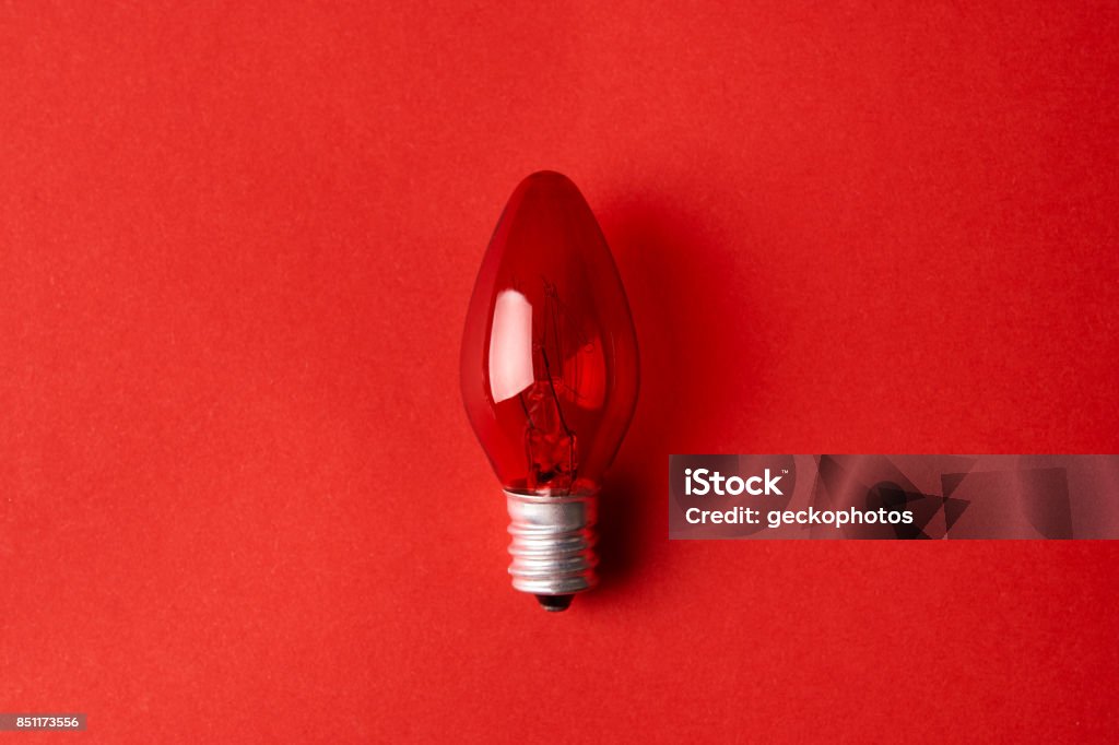 Red Light bulb on red background Red Light bulb on red background. Top view. Business idea concept. Azerbaijan Stock Photo