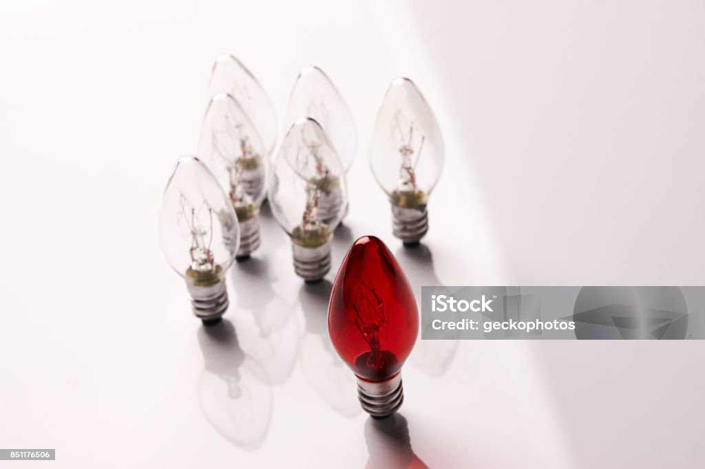 Light bulbs. Big idea concept Light bulbs. Big idea concept, Bright Creative and Leadership concept with one red lamp many different glass light bulbs on white background. Azerbaijan Stock Photo
