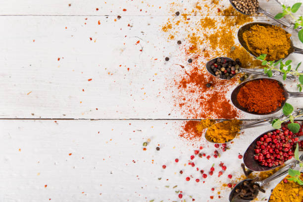 istock Various colorful spices on wooden table 851177432