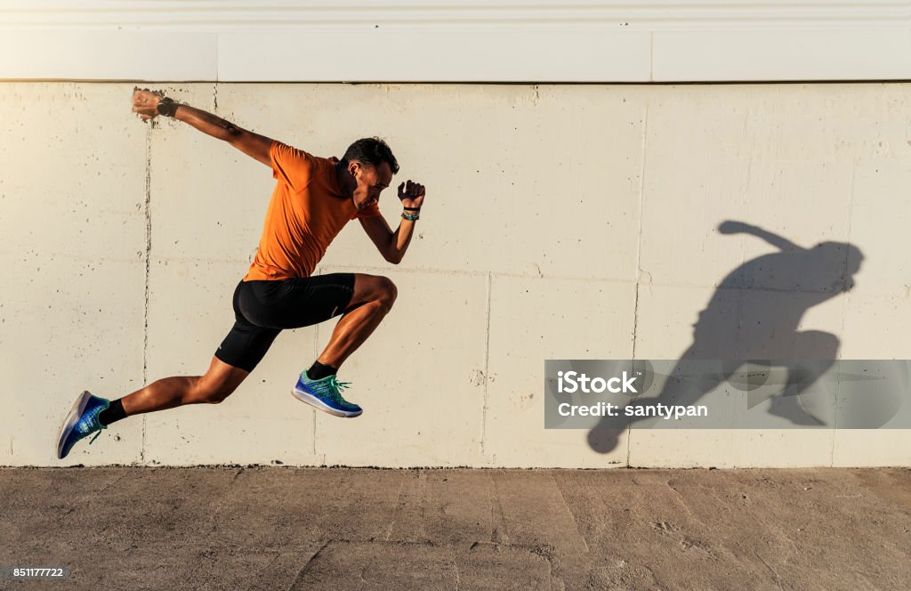 Handsome man running in the city. Running Stock Photo