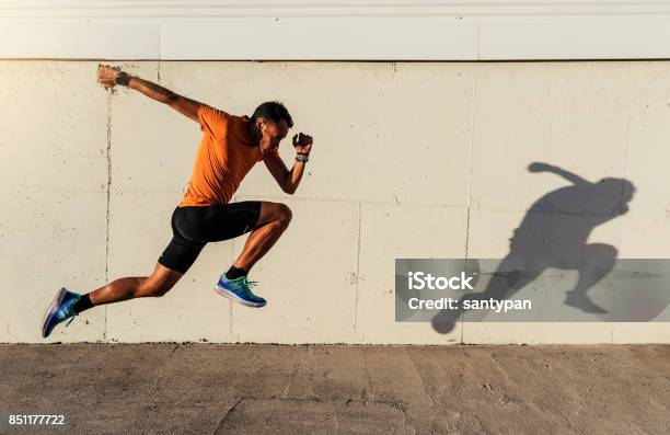 Handsome Man Running In The City Stock Photo - Download Image Now - Running, Speed, Jogging