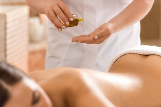 istock massage therapist with body oil 851180698