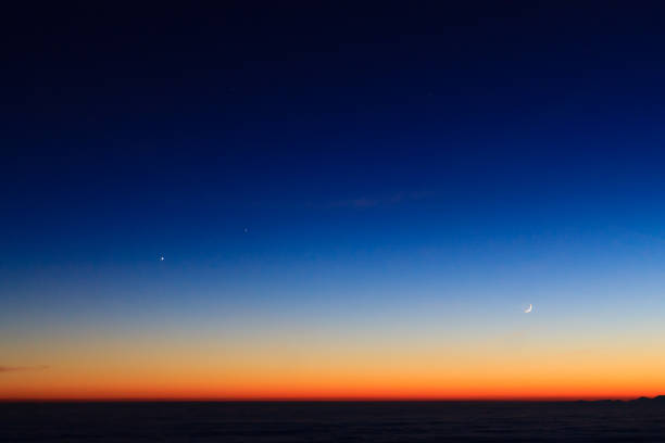 istock Mountain  silhouette over clouds,sky at twilight with moon 851197932