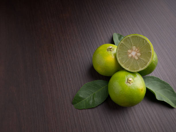 Lime on wood background, Top view stock photo