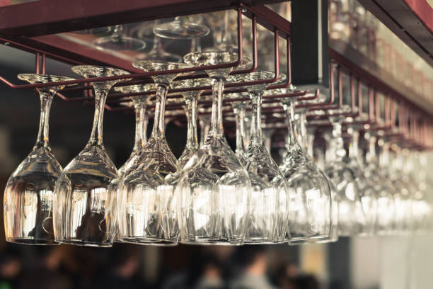 istock A row of clean empty wine glasses hang 851263798