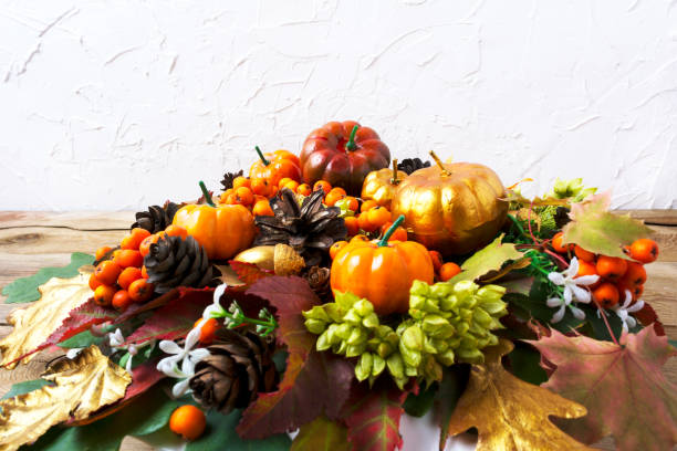 istock Thanksgiving greeting background with pumpkins and leaves table centerpiece 851322148