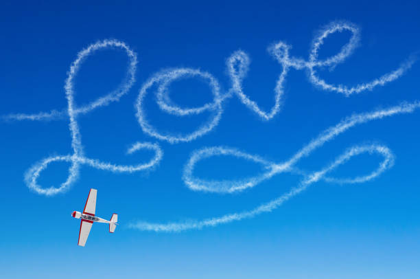 istock Love figurative inscription from a white smoke trail airplane 851330850